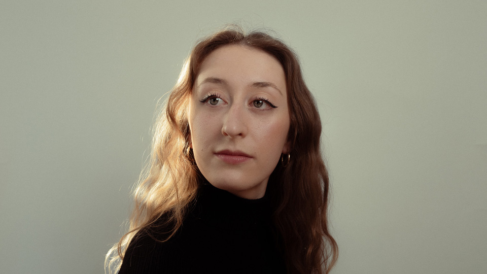 Francesca Lauri - A women with light brown hair, smiling, wearing a black top Francesca Lauri - A women with light brown hair, smiling, wearing a black top